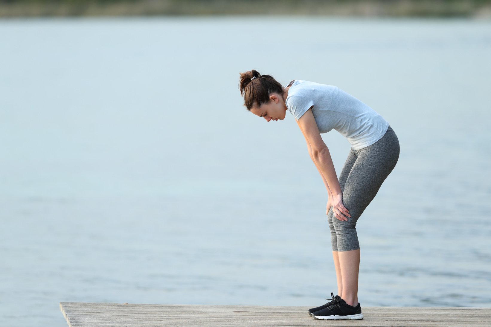 Fatigued runner stopping and resting after sport